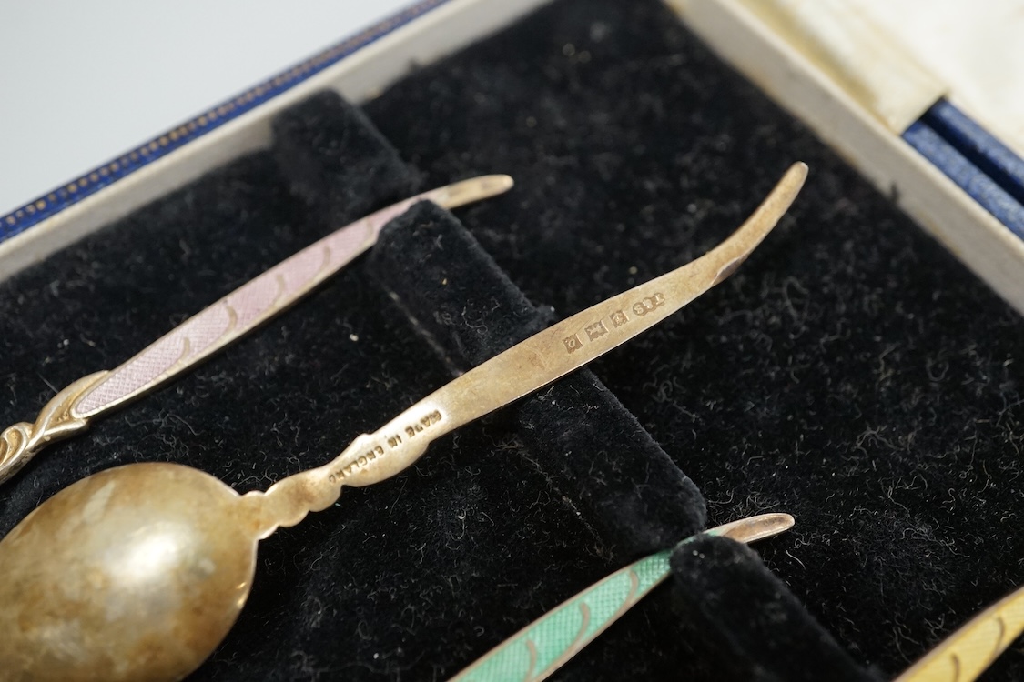 A cased set of six George VI silver teaspoons, James Dixon & Sons, Sheffield, 1948, a cased set of six silver and polychrome enamel coffee spoons and a cased single silver spoon.